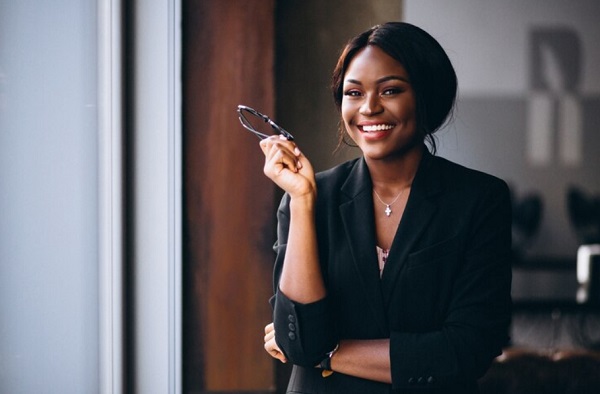 happy woman hand holding a white glasses