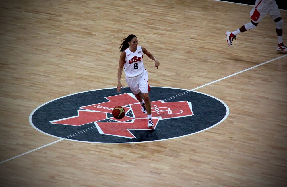 Sue is playing basketball