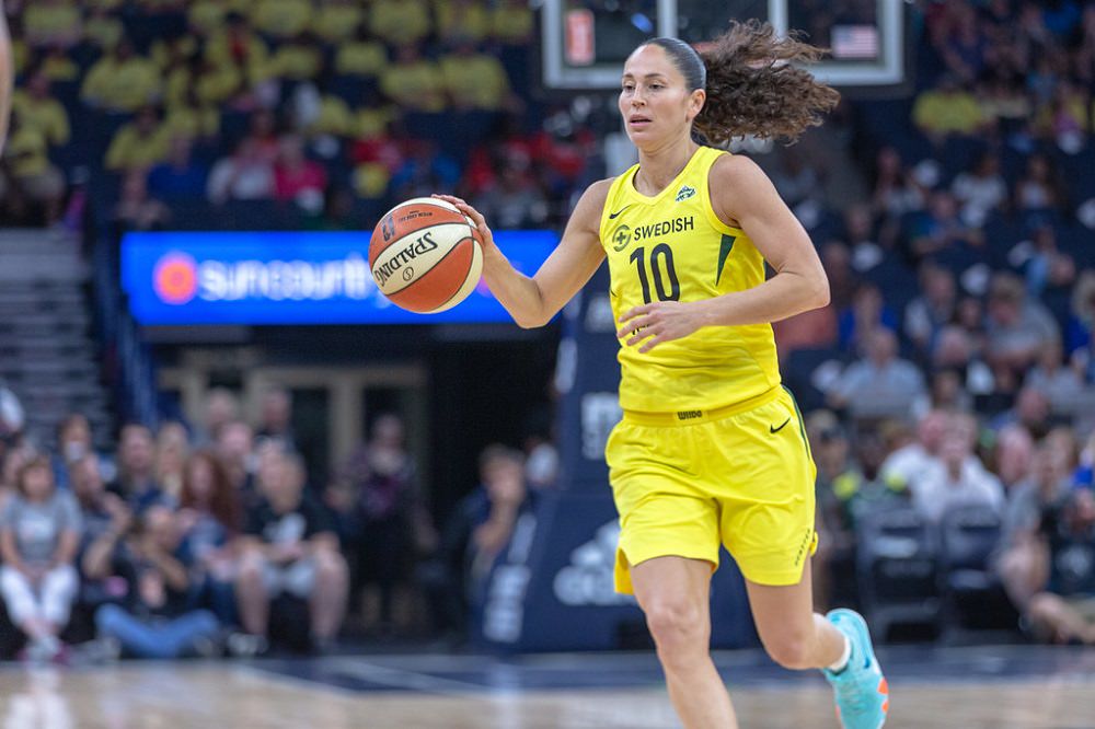 Sue Bird hand holding a football Ball