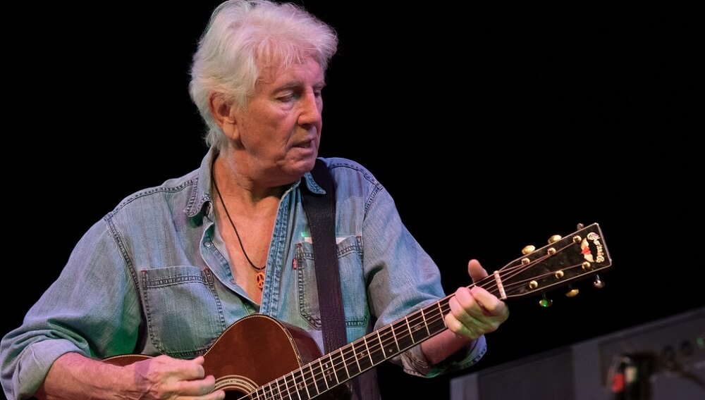 Graham Nash hold a Guitar