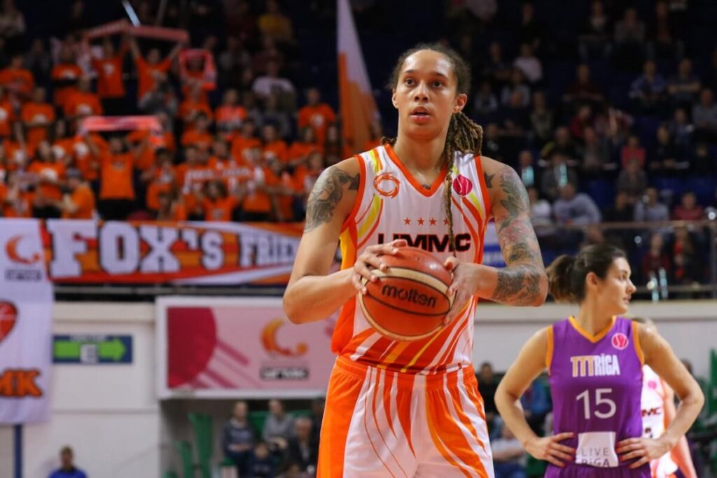 Brittney Griner hand holding a football ball